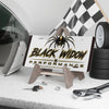 Black Widow Performance Vanity Plate metallic license plate with spider logo and brushed silver backing